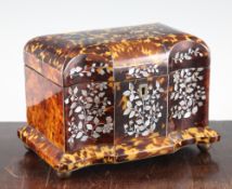 A Regency tortoiseshell and mother of pearl inlaid two division tea caddy, with serpentine front, on