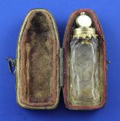 A cased late 18th century gold mounted cut glass miniature scent bottle with stopper and safety
