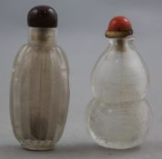 Two Chinese rock crystal snuff bottles, 1800-1900, the first of ribbed ovoid shape, 6cm, the