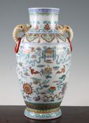 A Chinese doucai ovoid vase, the neck modelled with a pair of elephant head ring handles, painted