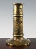 A 19th century Qajar Islamic pierced brass torch stand, 10.5in.