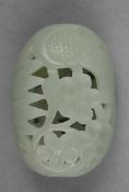 A Chinese pale celadon jade pendant, the hollow pierced oblong pendant decorated with prunus and