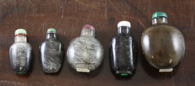 Five Chinese hair crystal snuff bottles, 1800-1900, of varying form and colour of stone, all with