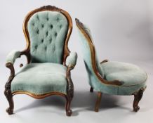 A pair of Victorian carved walnut ladies and gentlemen's button back chairs, one with open arms,