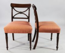 A set of six early 19th century mahogany dining chairs, with X shaped spars and reeded backs, with