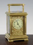 An Edwardian ormolu hour repeating carriage clock, with gilt fret work dial, 6.5in.