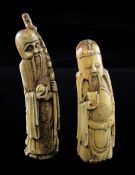 Two Chinese boar's tusk figures of immortals, early 20th century, each standing holding an