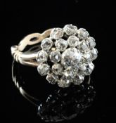 A 19th century style gold and diamond cluster ring, of flowerhead design, with pierced shank and set