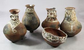 Four Papua New Guinea Aibom Village large clay sago storage jars, with typical stylised face