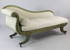 A Regency green painted and parcel gilt scroll end chaise longue, with reeded frame, downswept legs,