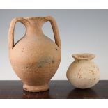 A Roman terracotta amphora and a Roman redware globular vase, c.2nd century AD, the amphora with