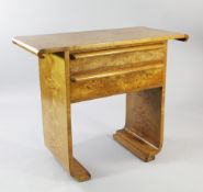 An Art Deco birds eye maple side table or serving table, fitted two frieze drawers, with scroll over