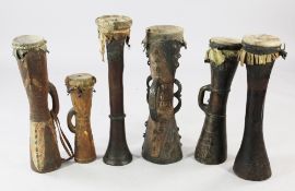 Six Papua New Guinea Sepik River Kundu wooden hand drums, of typical hour-glass form with skin tops,