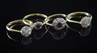 Two early 20th century 18ct gold and diamond cluster rings and two similar sapphire and diamond