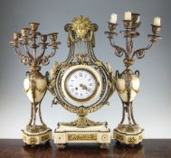 A 19th century French ormolu mounted white marble clock garniture, the lyre shaped mantel clock with