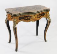 A Louis XV style marquetry inlaid and kingwood ormolu mounted folding card table, the serpentine top