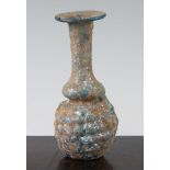 A Roman turquoise glass 'grape' flask, Syria 1st / 2nd century AD, with bottle neck and mineral