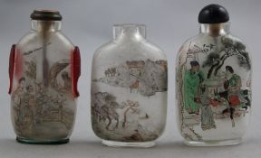 Three Chinese inside-painted glass snuff bottles, 20th century, all inscribed, the first with