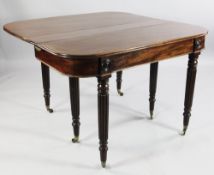 A 19th century mahogany extending dining table, the folding top with concertina action expanding