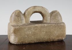 A Greek alabaster weight, c.500 BC, of rectangular form with a central looped handle flanked by