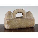 A Greek alabaster weight, c.500 BC, of rectangular form with a central looped handle flanked by