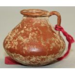 A Greek Attic redware small jar, of angular form with a single looped handle to the neck, 4.7cm