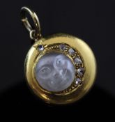 A gold, diamond and frosted glass "moon face" pendant, of circular form, the moon face with