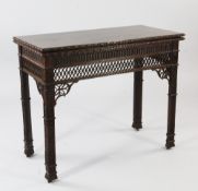 A Gothic Chippendale revival mahogany folding card table, the rectangular top with flowerhead border