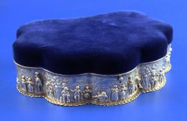 An Edwardian repousse silver mounted shell shaped trinket box, with velvet lid and interior and