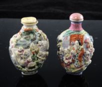 Two Chinese moulded famille rose snuff bottles, 1820-50, the first with boys playing in a pavilion