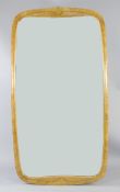 A 20th century Italian maple framed mirror, of shaped rectangular form, 5ft 9in. x 3ft 2in.