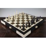 A Continental turned ivory and horn chess set, c.1920-30, complete with thirty two pieces, with 3.