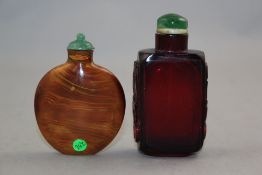 Two Chinese glass snuff bottles, 1730-1900, the first of ruby glass, the rectangular body with