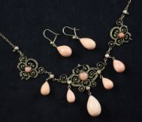 A late 19th century gold and coral drop pendant choker necklace and pair of earrings, the necklace