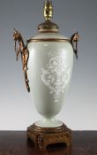 A French paté-sur-paté celadon ground and gilt metal mounted lamp base, late 19th century, decorated