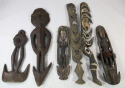 Papua New Guinea Sepik River, a collection of four carved wooden tribal food hooks, two similar,