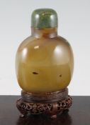 A Chinese shadow agate table snuff bottle, of ovoid form, well hollowed, later glued to a rosewood