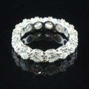 A white gold and diamond full eternity ring, set with fourteen round brilliant cut stones with an
