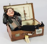 An Edwardian ventriloquist's dummy, 'Jimmy Green', painted papier mache and wood with moving glass