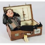 An Edwardian ventriloquist's dummy, 'Jimmy Green', painted papier mache and wood with moving glass