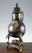 A 19th century Pontypool toleware urn, of pear shape with scroll handle, on three scrolling legs and