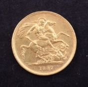 An 1887 gold two pounds, good VF