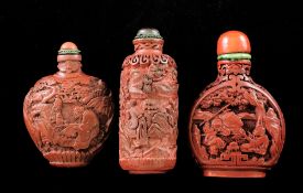 Three Chinese cinnabar lacquer snuff bottles, 1750-1850, each carved in relief with figures in