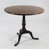 A George III mahogany circular tilt top tripod table, with twist turned central column, W.3ft