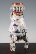 A Japanese Arita porcelain coffee pot, c.1700, the conical body moulded with birds and flowers and