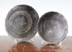 Two Greek blackware bowls, Apulia, c.4th century BC, each impressed to the centre with a 'roulette