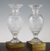 A pair of cut glass vases, first half 19th century, probably Baccarat, the facet cut ovoid bodies