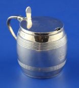 A George III silver barrel shaped mustard pot by Robert, David & Samuel Hennell, with reeded bands