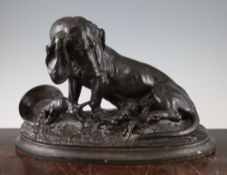 A late 19th century French patinated bronze figure group of a female Bassett hound and puppies, on