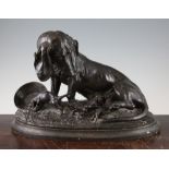 A late 19th century French patinated bronze figure group of a female Bassett hound and puppies, on